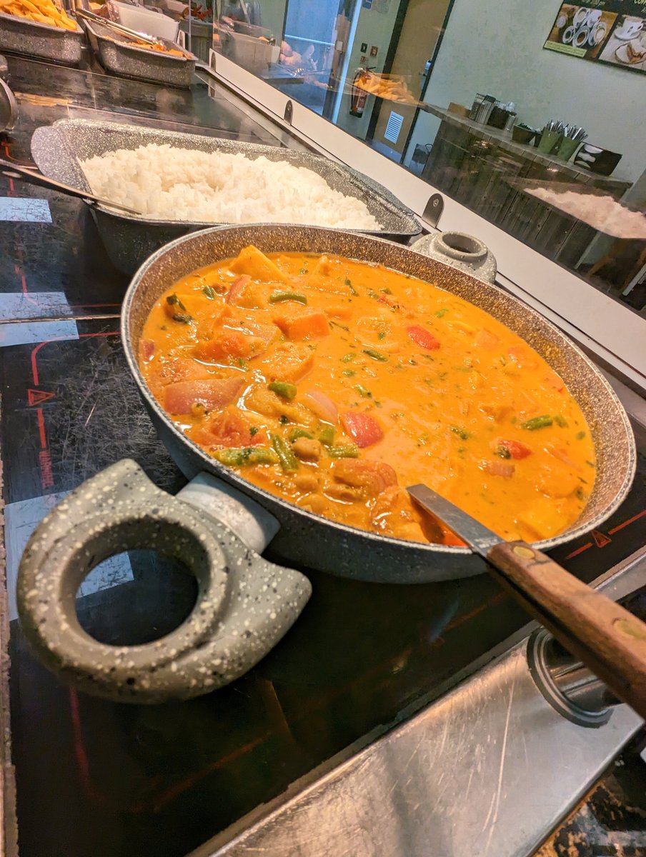 Today at Drake's Kitchen, we're offering two mouthwatering curries for lunch. Take your pick between our Indonesian vegetable and chickpea curry or our Chicken Massaman. Each dish is accompanied by fragrant jasmine rice, garlic naan, a yogurt dip, and toasted coconut.