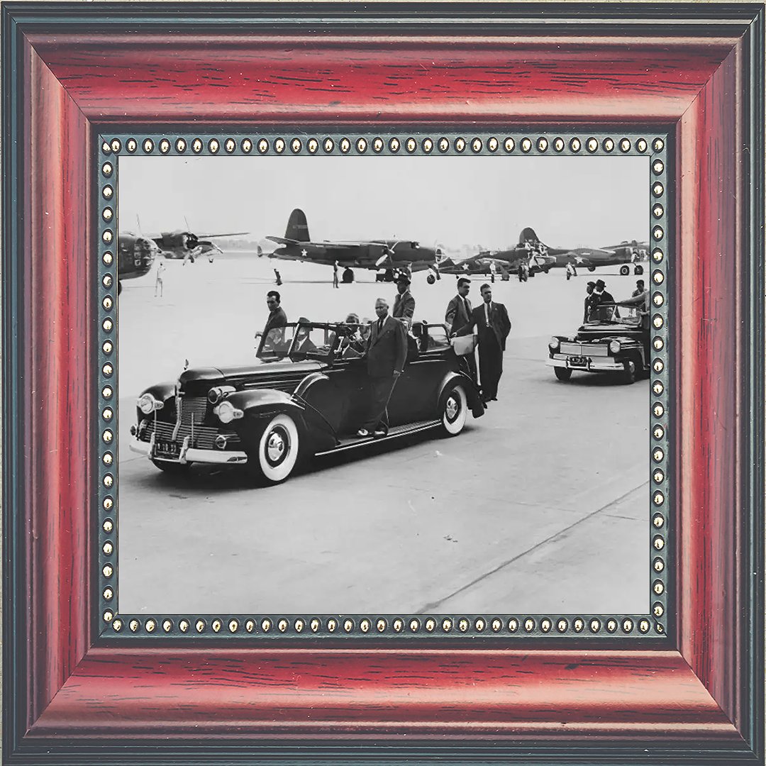 Secret Service agents hang on to the 'Sunshine Special,' a 1939 Lincoln Model K that was the first limousine built to Secret Service specifications, at Willow Run Airport near Ypsilanti, Michigan.
