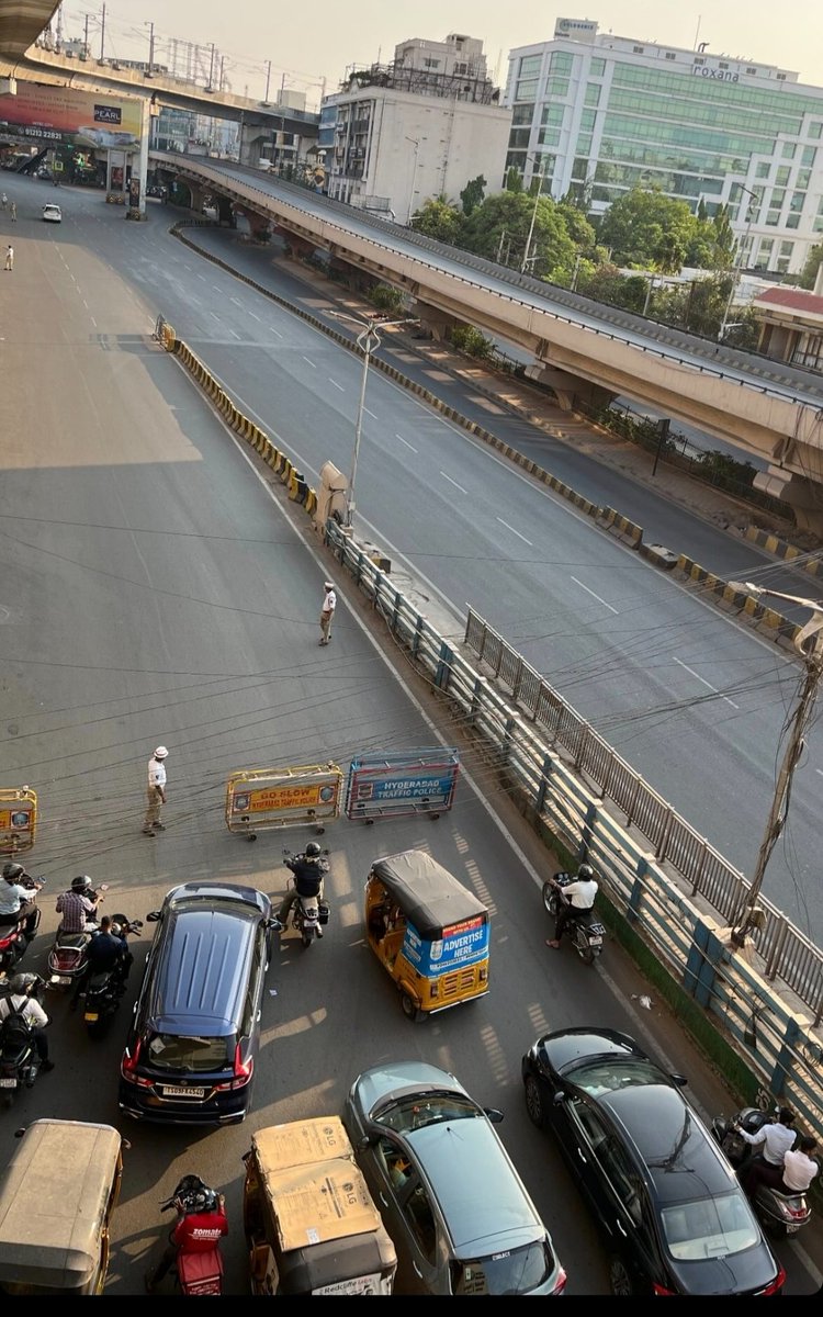 Traffic stopped again for CM Revanth's convoy second day in a row. Can't the police have a channel at least instead of disrupting and making people wait in the heat I wonder. Waiting for a few seconds even in this heat is terrible. #Hyderabad #Summer