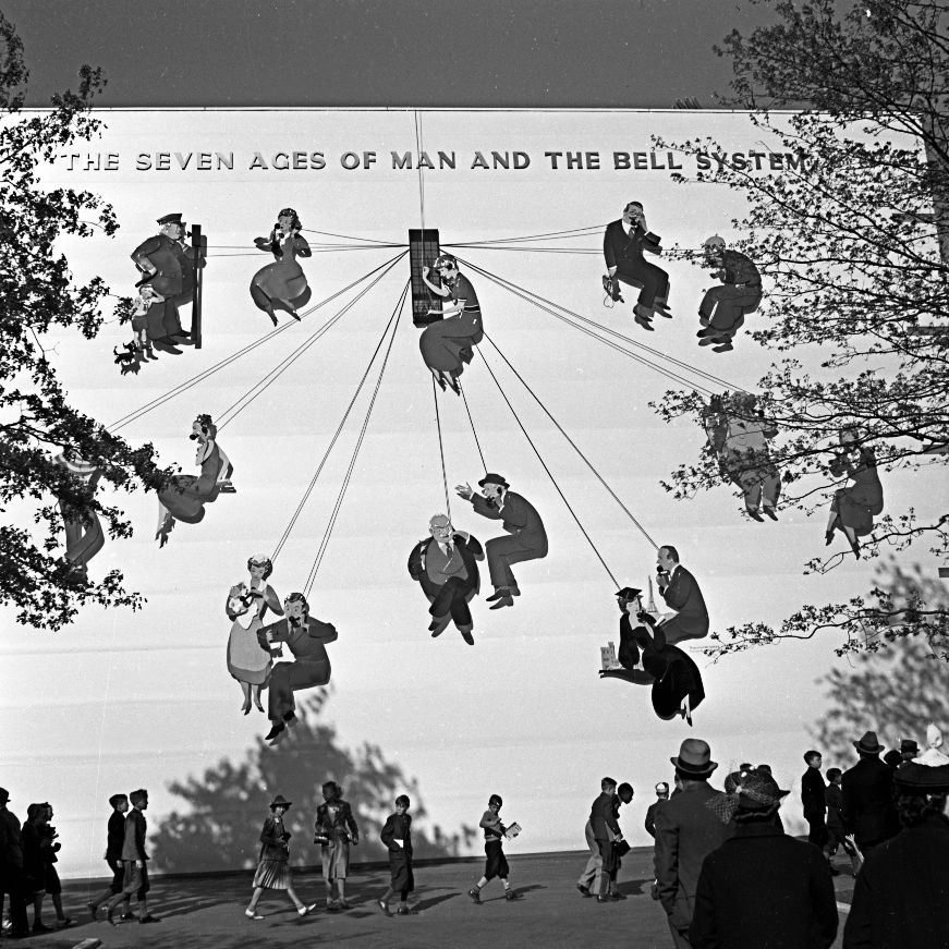 It's National Telephone Day! This from the 1939-40 World's Fair shows visitors under a playful AT&T mural featuring a switchboard operator and people talking on phones. Photo by Bob Golby☎️ #NationalTelephoneDay #QPLarchives #NewYorkWorldsFair #1939WorldsFair #oldtech