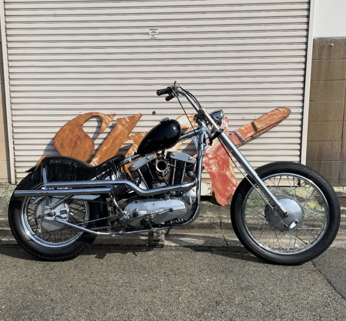 This ironhead from @shixmotorcycle is pretty rad. love the chrome frame, long high shotgun pipes, fringe seat, and stance. Style For Days.. #choppershit #ironhead #chopper #ironheadchoppers #ironheachoppers #moto #hd #harley #chopshit