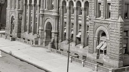 Eagle statues by the entrance. 
'The Federal Building in Detroit, also known as the United States Courthouse and Post Office, took approximately two years to build. Construction began in 1895 and was completed in 1897.'