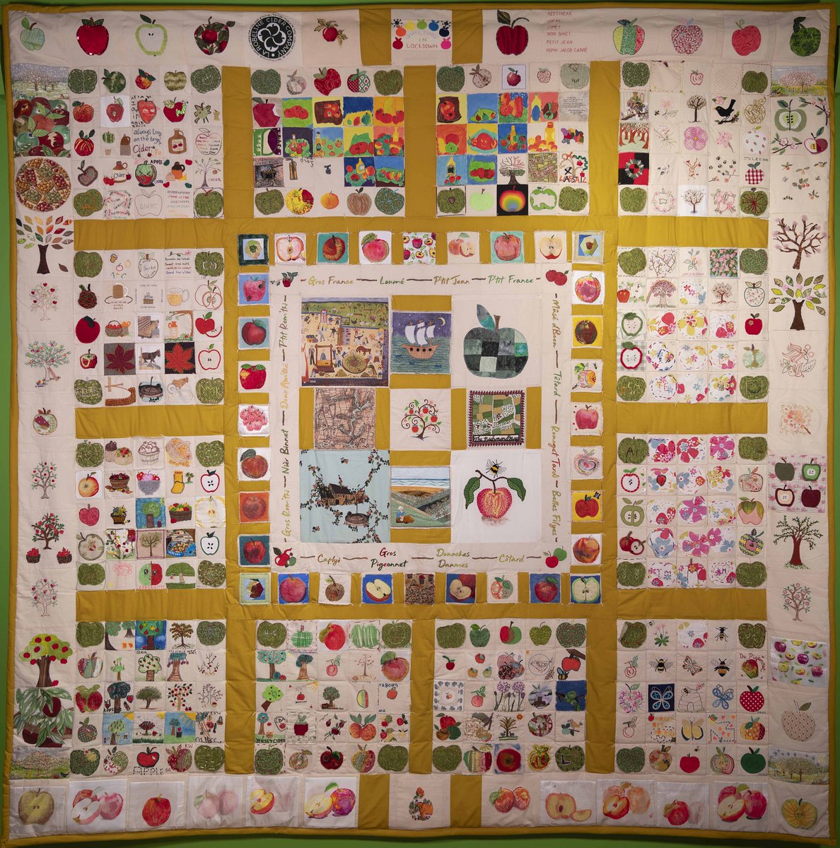 #OTD one year ago, the beautiful Jersey Cider Apple #Quilt – la couvèrtuthe pitchie d’la pomme à cidre Jèrriaise – was completed. Happy anniversary to everyone who contributed to this wonderful #Community project! #Apples #Cider #Handmade #Patchwork #Volunteers #OurIslandStory