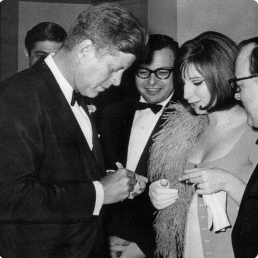 This pic is from the 1963 White House Correspondents' Dinner, JFK meeting Barbara Streisand. This year's event is Saturday night. Biden will be great.