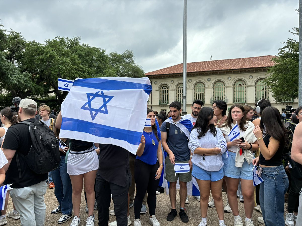 Members of UT-Austin group Longhorn Students for Israel are holding a counterprotest right by the faculty event. They’ve been chanting and singing.