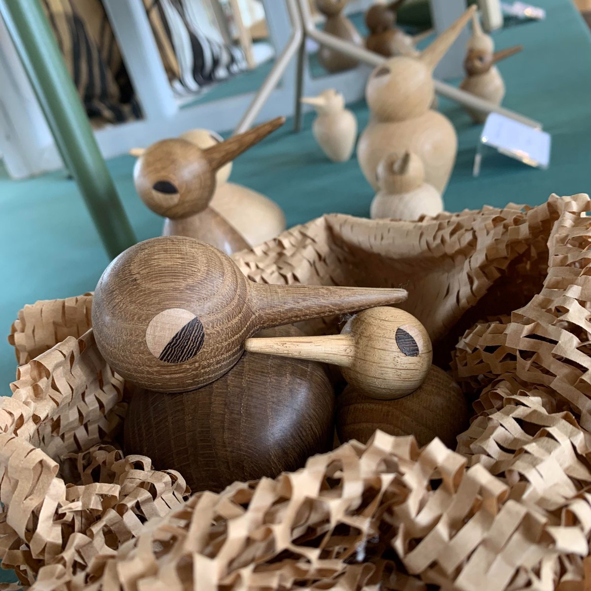 These little birds by were designed by Kristian Vedel in 1959. Beautifully produced by @ArchitectMade  in oak, wenge and maple wood, they've taken over a whole table in The Home... & they've made friends with the Eames elephant! Available from The Home or saltsmillshop.co.uk