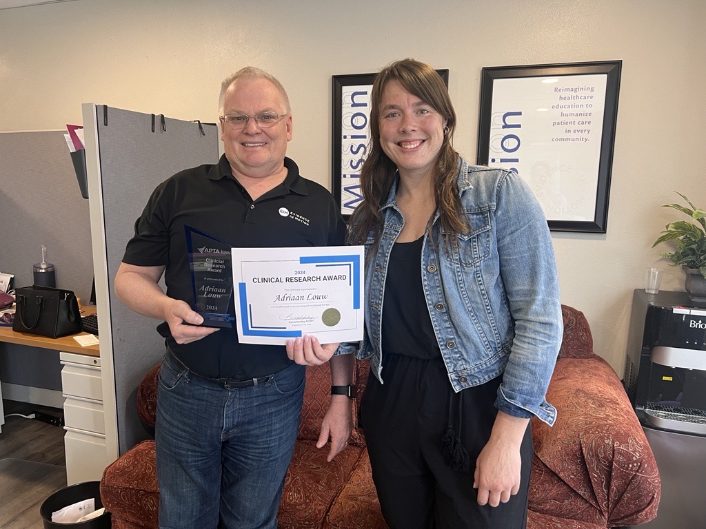 EIM's very own, Dr. Adriaan Louw, just received a 2024 Clinical Research Award from the APTA Iowa and they hand delivered it! 🎉 We are passionate about lifelong learning and patient care supported by the latest research and our faculty reflects that. Way to elevate, Adriaan!