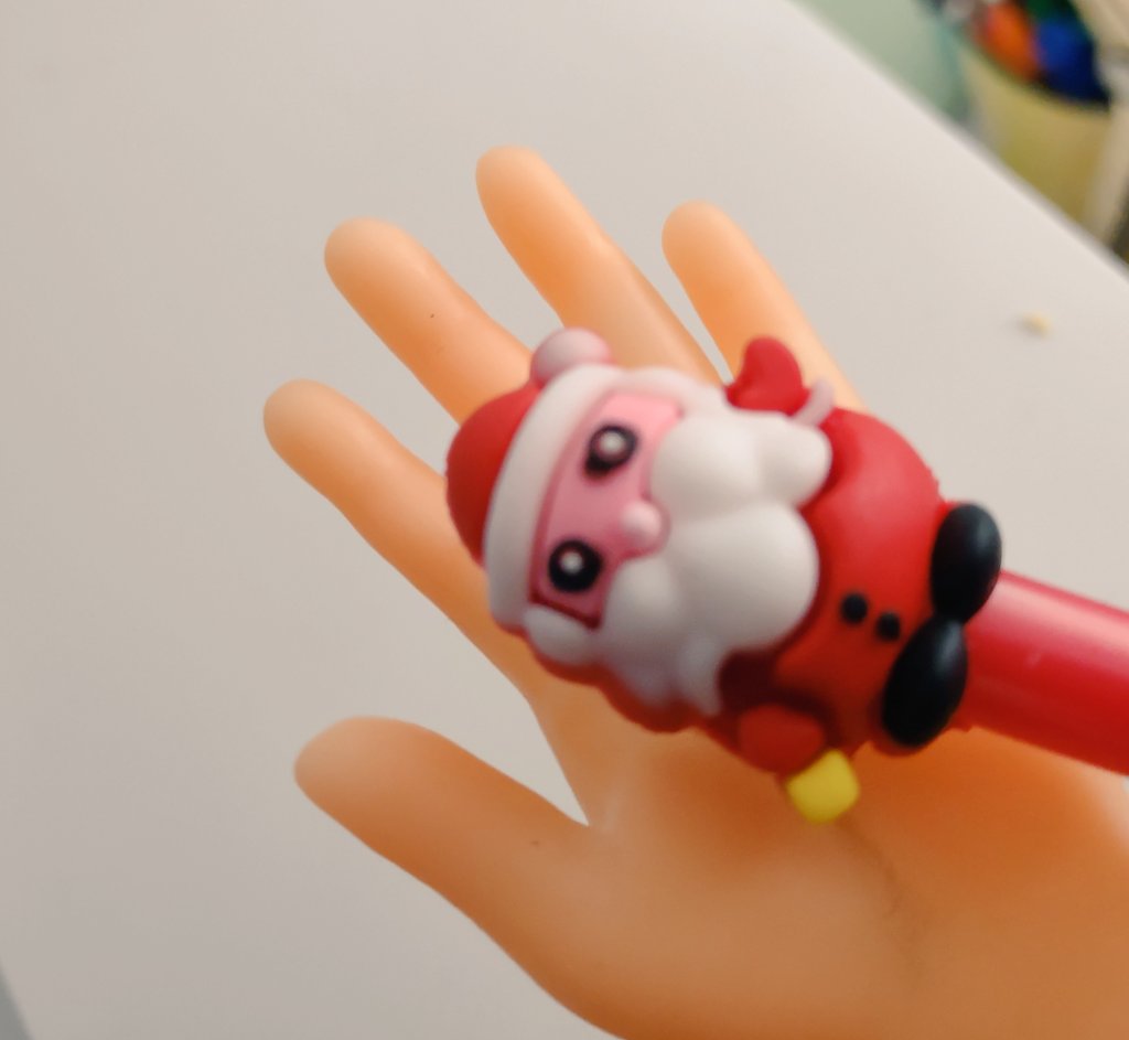 #Santa in my tiny hand.