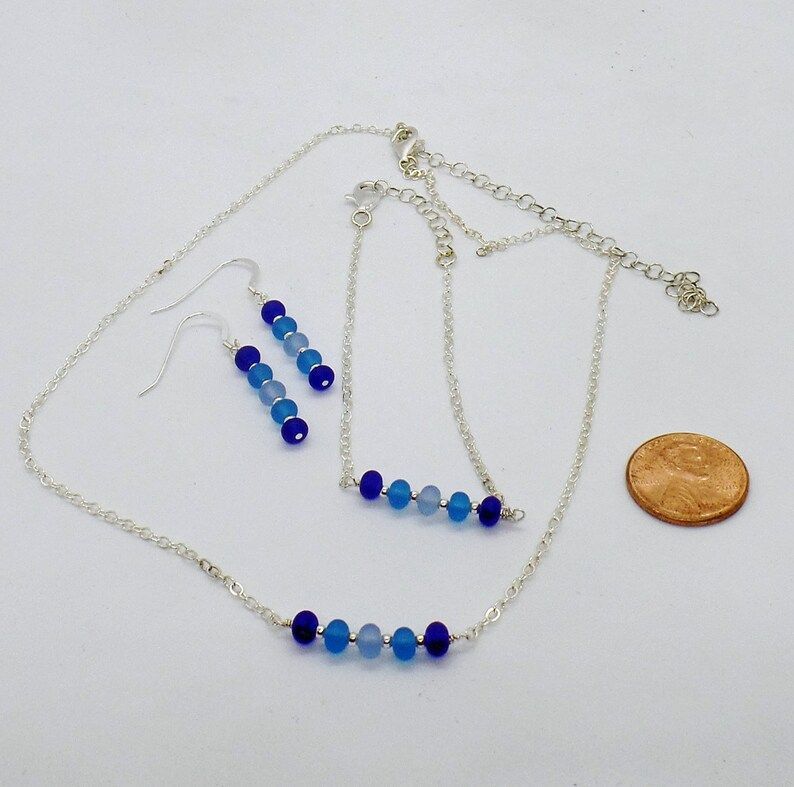 Explore the beauty of Blue Ombre Sea Glass with this stunning Sterling Silver set from RivendellRocksSedona. Dark Blue hues perfect for any occasion. #SeaGlassJewelry #RivendellRocksSedona  buff.ly/49KS5P8