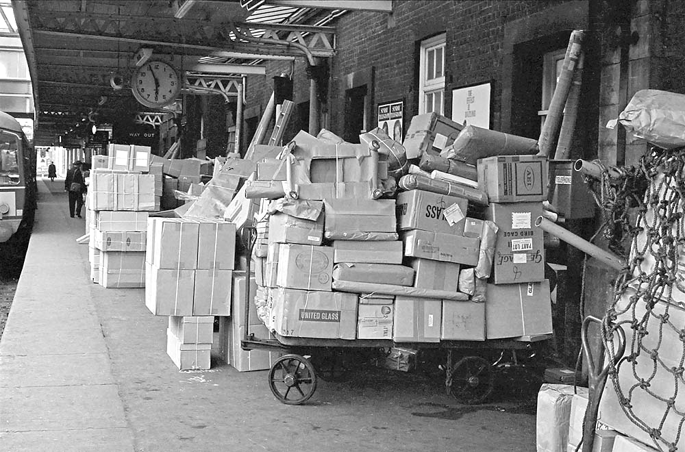 Nuneaton Station, 13th August 1964 Parcel traffic on platform 1 being made ready for loading on to one or more services to the north of England. The definition of parcels in steam days was, as can be seen, very broad being most things that could be loaded and transported safely