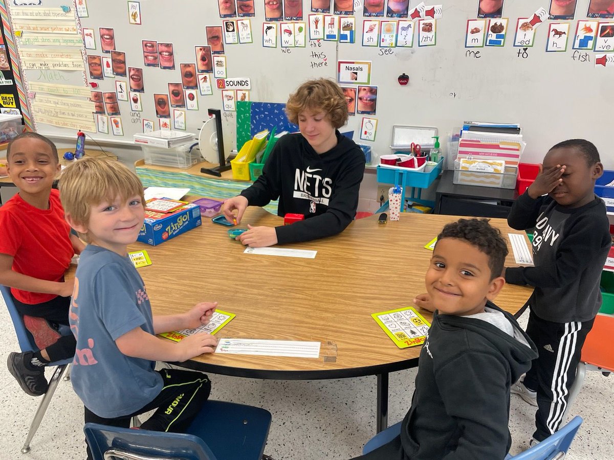 At Woodstock, “Bring Your Kid To Work Day” is also “High Schoolers Help With Phonics Day!”