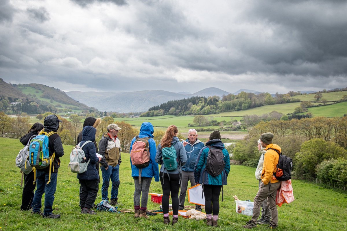 Conservation and Land Management MSc students learning plant identification in wild flower meadows with Trevor Dines and the fine art of pooting. Photo Mathew Harrison.