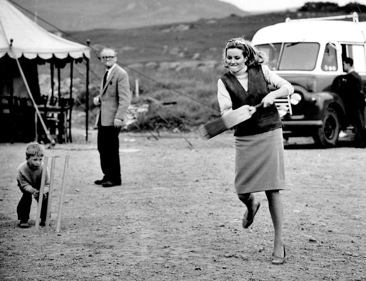 Behind the scenes with Daniela Bianchi playing cricket on location at Lochgilphead, Argyll and Bute, Scotland during filming for From Russia With Love (1963) #JamesBond