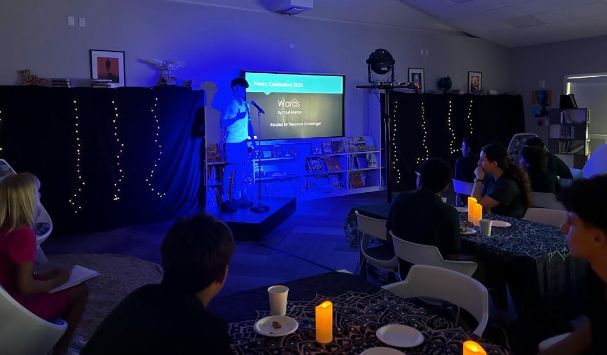 PCInnoInstitute's tweet photo. In celebration of National Poetry Month, the Findeiss Library hosted our first ever Poetry Slam. With the library sporting a cozy cafe vibe, #PCGrade8 English students gathered to recite and perform their original poetry as well as published poems from Poetry Out Loud. #poetry https://t.co/JHc13aUKRW