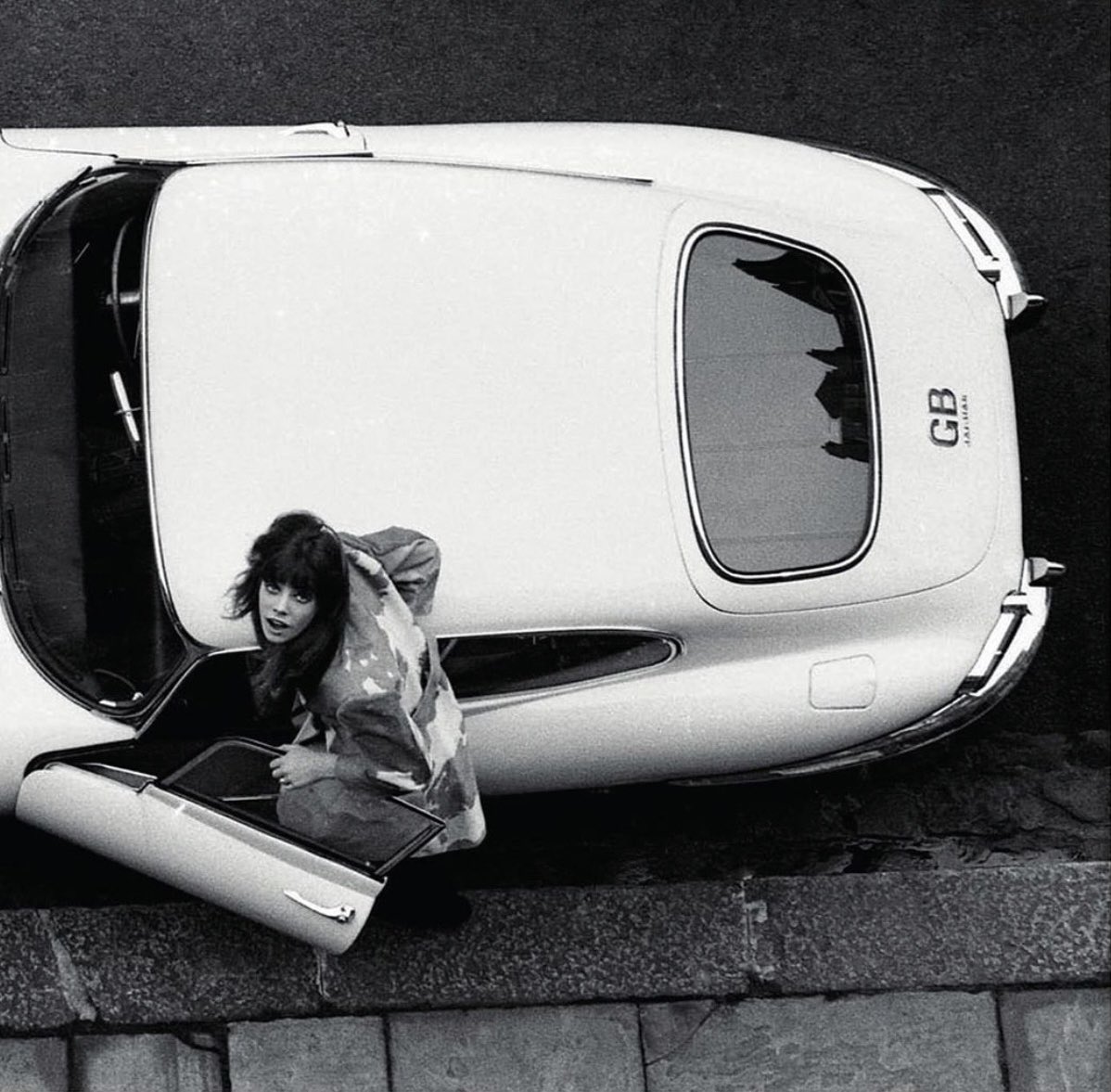 A girl on the go. #JaneBirkin hops in her Jaguar E-Type, 1965. #OPInspiration