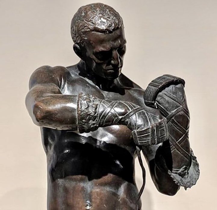 Caestus by Charles Henry Niehaus, 1883-85, cast 1901, bronze. The caestus was as an early form of boxing glove used in Ancient Rome made from strips of animal hide usually fitted with studs or spikes to maximise potential injury to opponents.