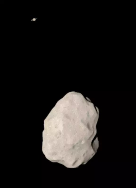 this is asteroid lutetia with saturn in the background 🪐
