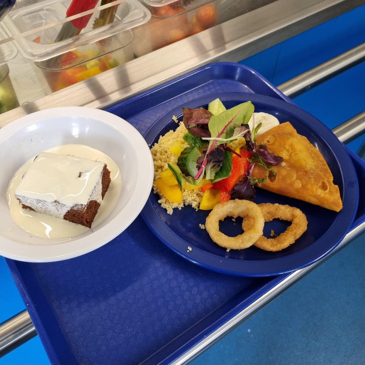 This was Wednesday's school dinner...chicken tikka samosa, cous cous, salad and onion rings. Chocolate fudge cake and cream for dessert...
Where are the concrete chips? The soggy semolina?
How times have changed.