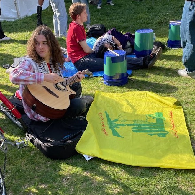 A Hezbollah flag displayed by pro-Palestinian protesters at Princeton University. Hezbollah’s ideology can be summarized as Shi'i radicalism. Hezbollah follows the Islamic Shi'a theology developed by Iranian leader Ayatollah Ruhollah Khomeini.