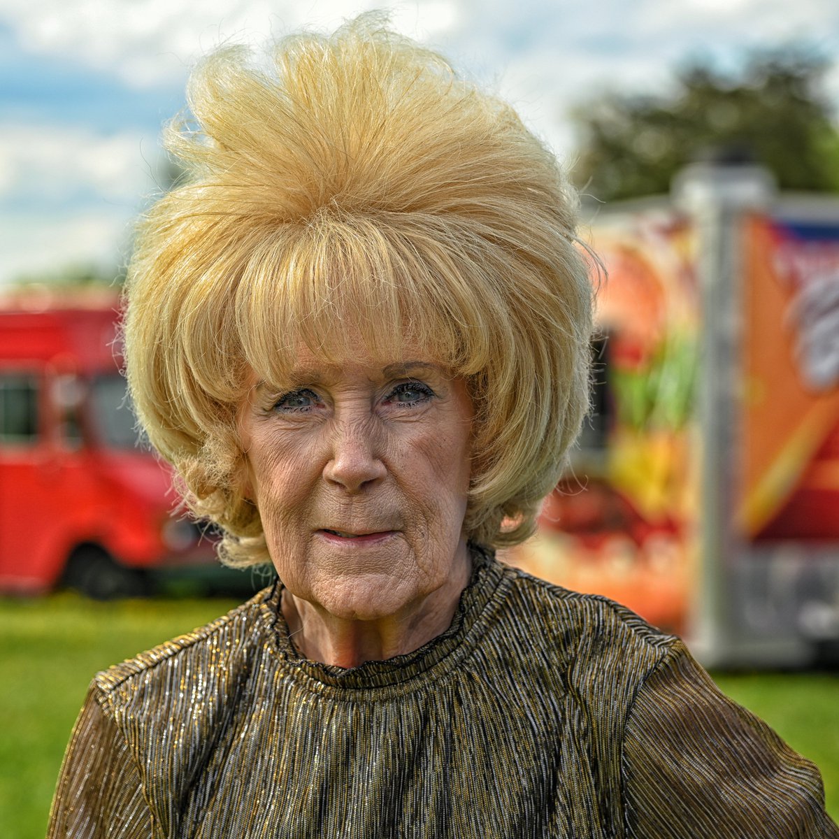 When I saw this stylish lady walking around a food truck festival yesterday I knew I had to get a portrait of her. Lois, age 83, was great. She was all over the place with her great grandson looking for just the right food. #streetphotography #portrait