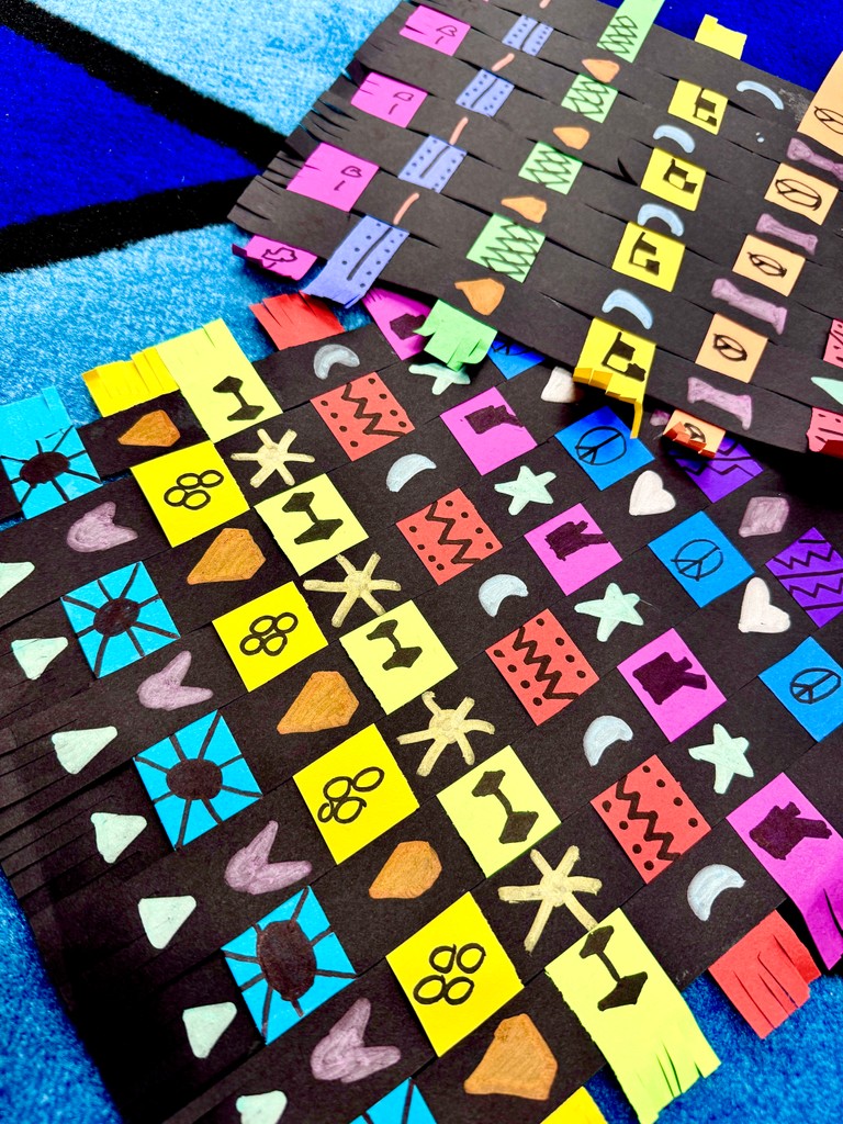 1st graders practiced their weaving skills with 1 inch paper strips! We read 
"The Spider Weaver" and used Kente Cloth as our inspiration!