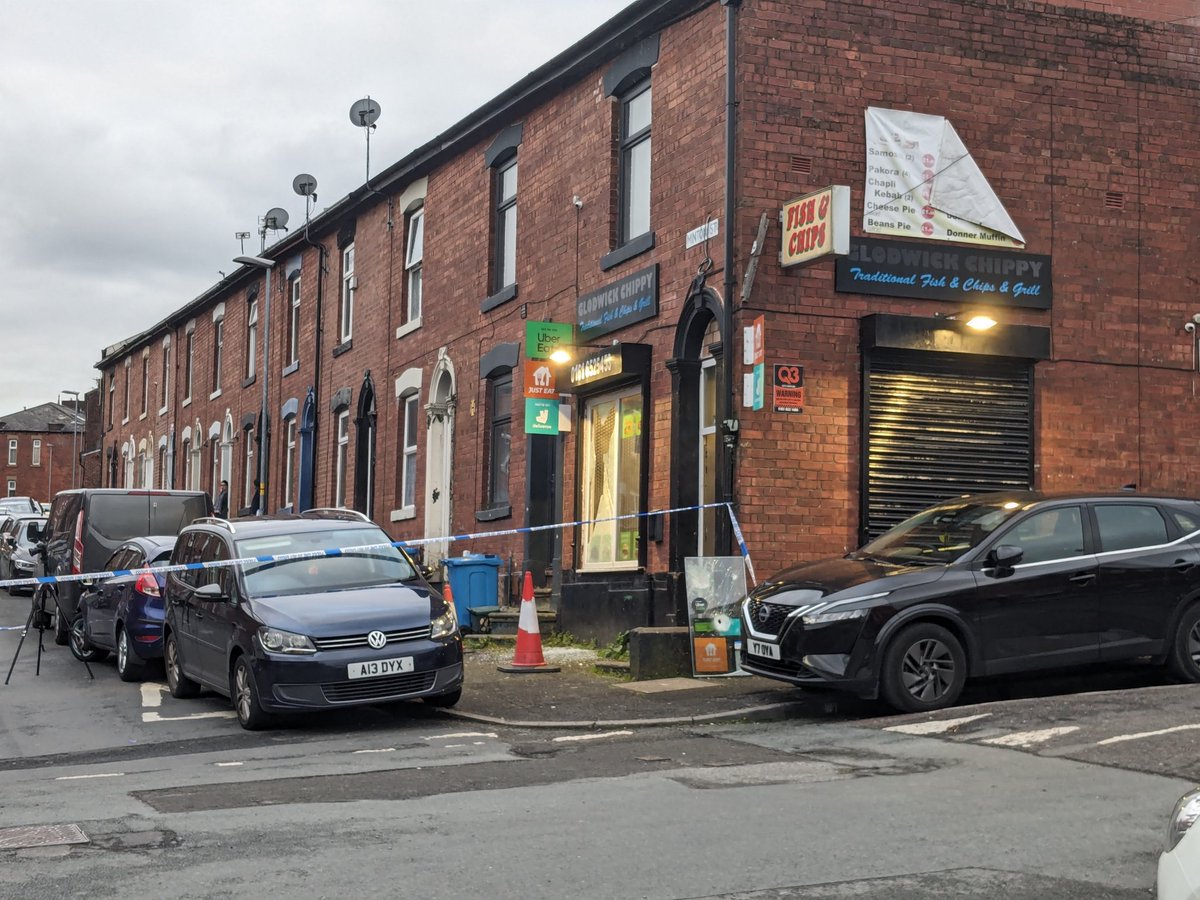 The cordon is around Glodwick Chippy in Minton Street. Windows are damaged, one has been removed @MENnewsdesk