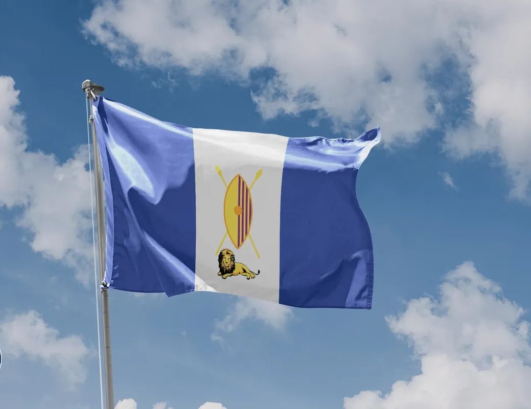 THE BUGANDA FLAG
1. 🦁 Lion:symbolizes strength, courage, &amp; leadership, reflecting e historical significance of e Buganda kingdom.
2. shield &amp; spears represent protection and defense, highlighting e importance o security &amp; unity within e kingdom,Blue - water bodies,white - peace