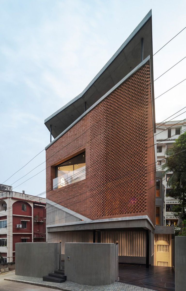 patterned brickwork enfolds multi-leveled residence by purple ink studio in india buff.ly/3JoLYUN