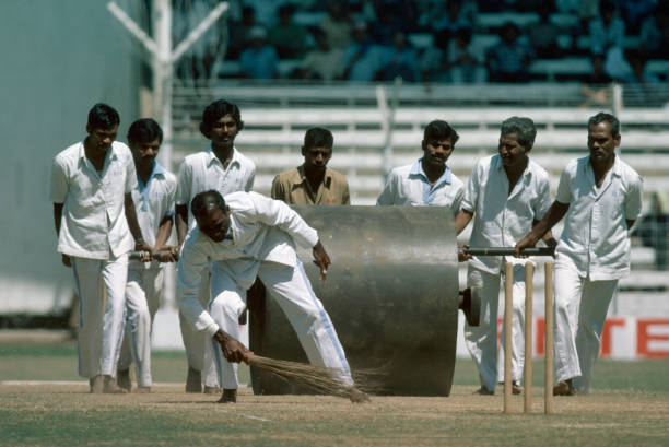 Groundstaff work on the pitch during an interval on the first day of the Jubilee Test between India and England at Bombay's Wankhede Stadium, February 15th 1980