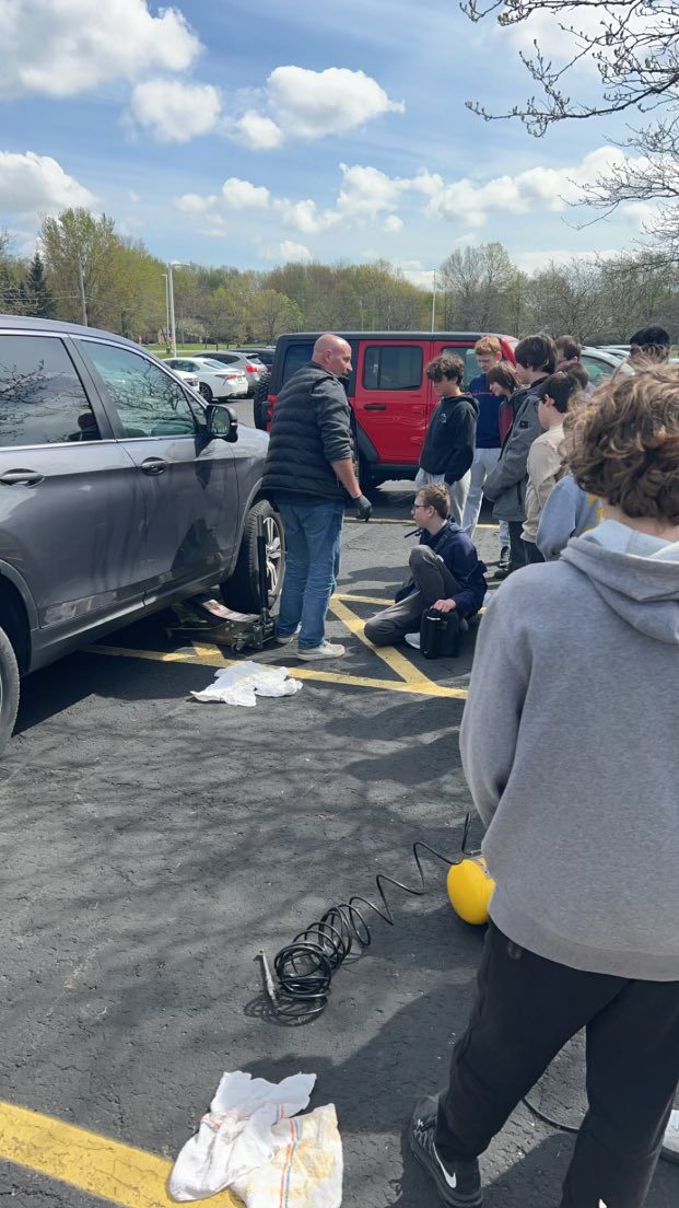 This is compliments of Board Member Bob Perez and features teacher Bryce Burkard showing middle schoolers how to change a tire.