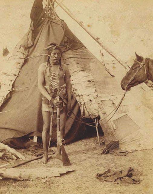 A heavily armed American Indian warrior keeping a vigil to protect his land. They lost their lands through fake assurances and fake agreements which the Anglo Saxon settlers never intended to honor. #Gold, Glory & #God: A Curse on the Natives (Sattology) a.co/d/7nJeF9H