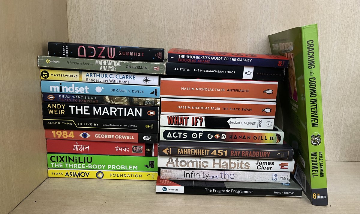 my humble bookstack (sci fi dominated)
