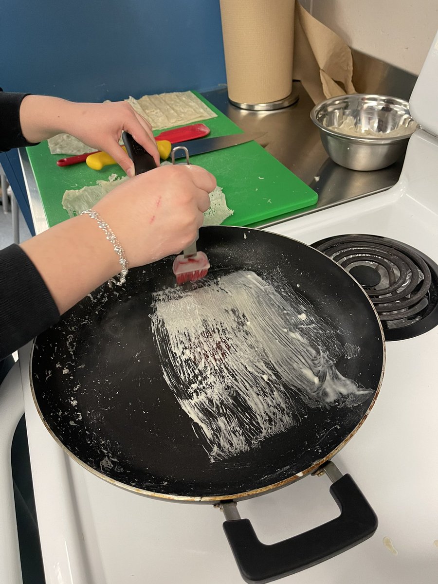 MmeDorval's tweet photo. A small team of students made lumpia and even made the gluten-free wrappers for them. They “painted” the batter onto a warm pan, pealed the sheet off and used a knife to trim them into uniformly sized wrappers. 🔗 Recipe link in bio. @SacredHeartOCSB #SacredHeartHospitality https://t.co/FAFBiFUpBA
