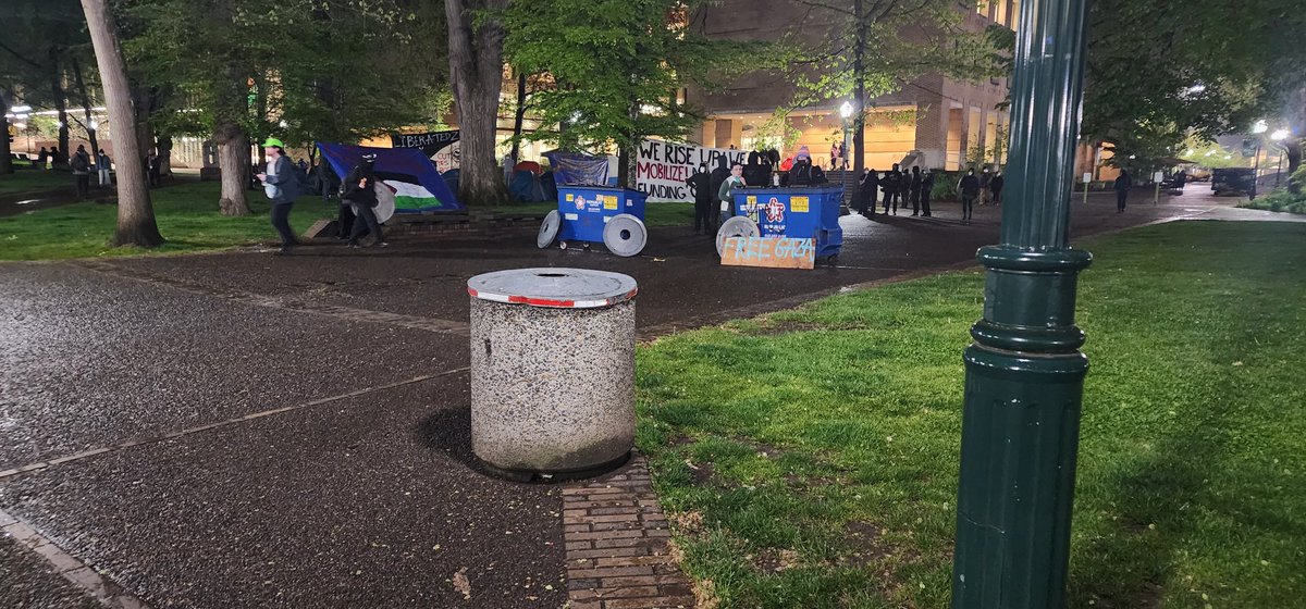 TheRealCoryElia's tweet photo. I'm at my Alma Mater, Portland State University, where a protest crowd has sent up an encampment to protest the partnership between PSU and Boeing and their involvement with Israel's war against Palestine. There's a small crowd here already and more people appear to be showing up https://t.co/aHEY7k1HKa