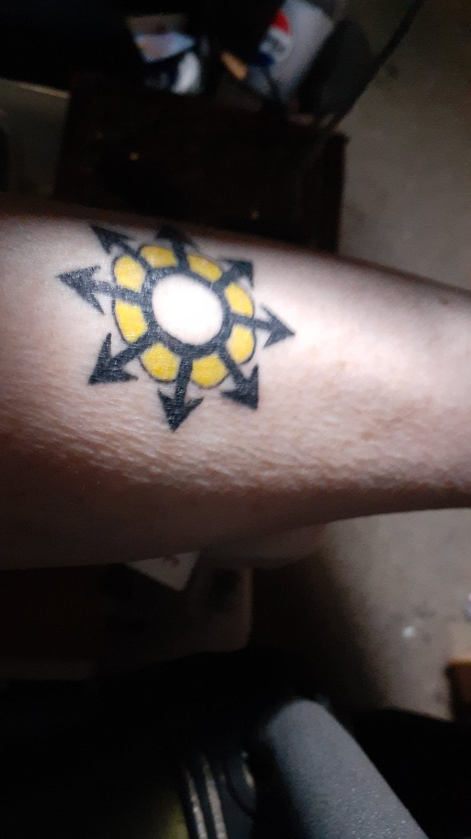 I got a Mad Pride tattoo. The Chaos Star is for chaotic resistance and the Flower is for nonviolence.