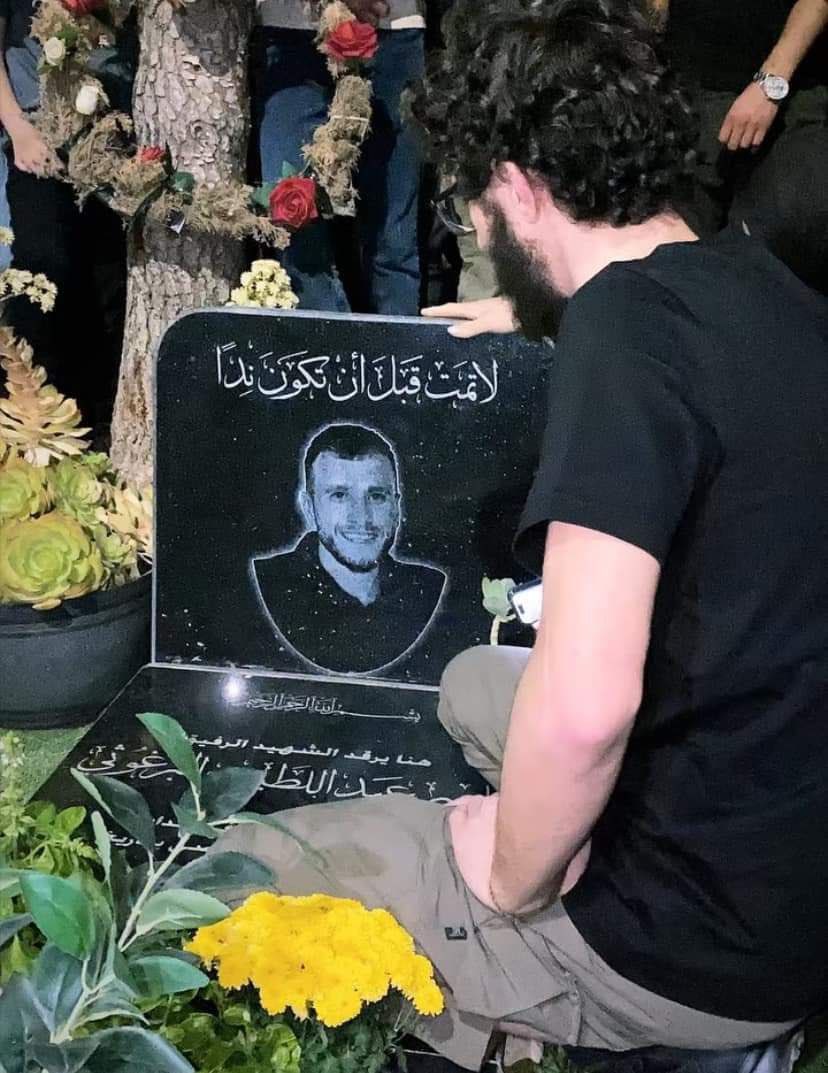 Immediately after his release Prisoner Ayham Barghouti from the town of Beit Rima in Ramallah visits the grave of his brother Nasser Barghouti, who was shot dead by the occupation in October.

The grave says “Do not die before you become a rival” by Ghassan Kanafani