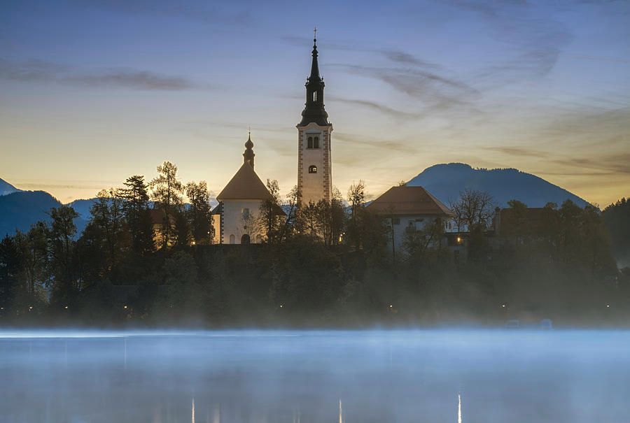 Morning at Lake Bled Island Slovenia! buff.ly/4chUYbF #slovenia #lakebled #bled #castle #church #tower #dawn #misty #lake #travel #travelphotography #AYearForArt #BuyIntoArt #giftideas @joancarroll