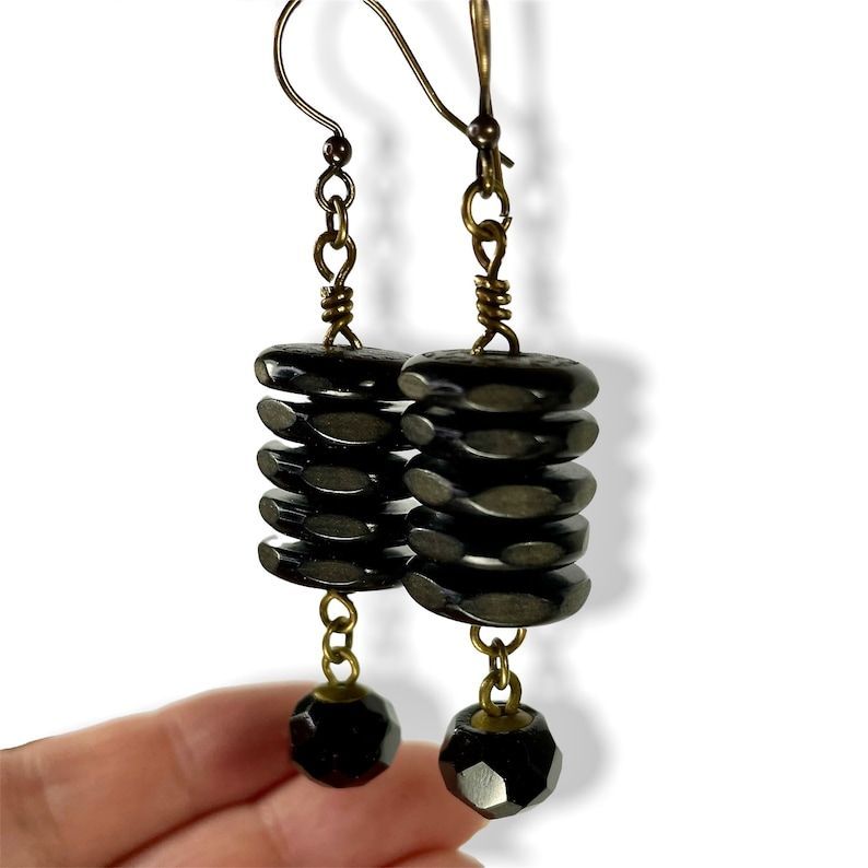 Looking for some unique earrings?  CHECK THESE OUT-> Repurposed Stacked Vintage Buttons, Black Dangle Earrings, Upcycled Handmade Jewelry Gift - Etsy buff.ly/3xMVv5o #buttons #earrings #mothersday