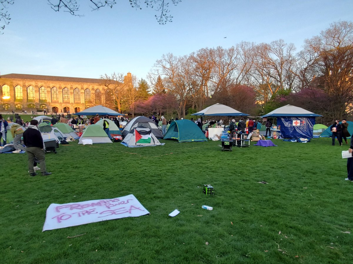 Brief update here while my editor handles the full story: the protest has only grown since this afternoon, now has a medical post and many more tents. A single police car is parked at the edge of the park.