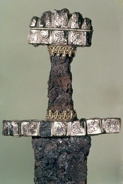A richly ornamented Viking-age sword found at Hedeby with a hilt covered in sigils.

Which of these symbols do you recognize?