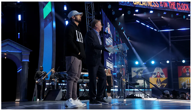 Eminem at the #NFLDraft is cool. A classic rapper that looks like a coach on stage. #NFLDraft2024 #NFLDraftDetroit | Roger Goodell| Drake Maye| JJ McCarthy| Jayden Daniels| Embiid