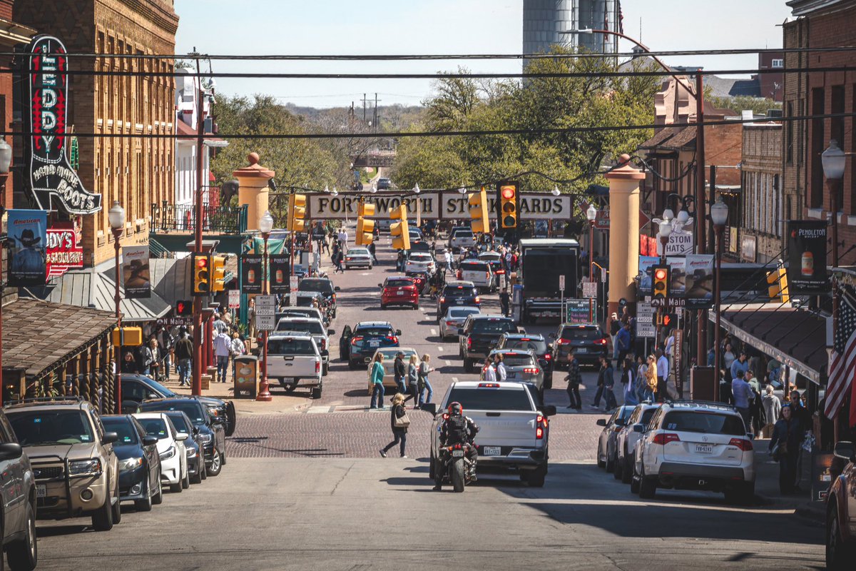 The Fort Worth Stockyards.

Cool place.  Country boy heaven.  Nice restaurants, rodeo arena, lots of hotels, and lots of rowdy bars.

Safe enough for the family, too.