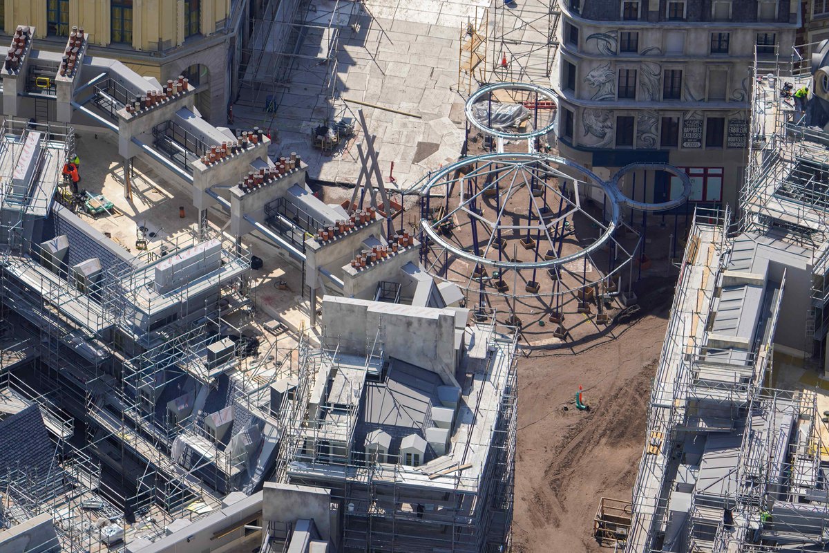 Aerial look at tent frame added in the intersection of 5 streets of Paris in the Harry Potter land in Epic Universe. Tent will be the entrance of the theater attraction in the land.