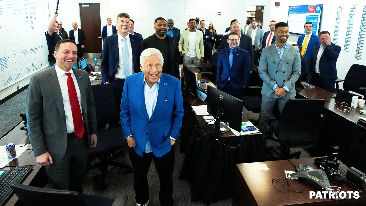 All smiles in the draft room.