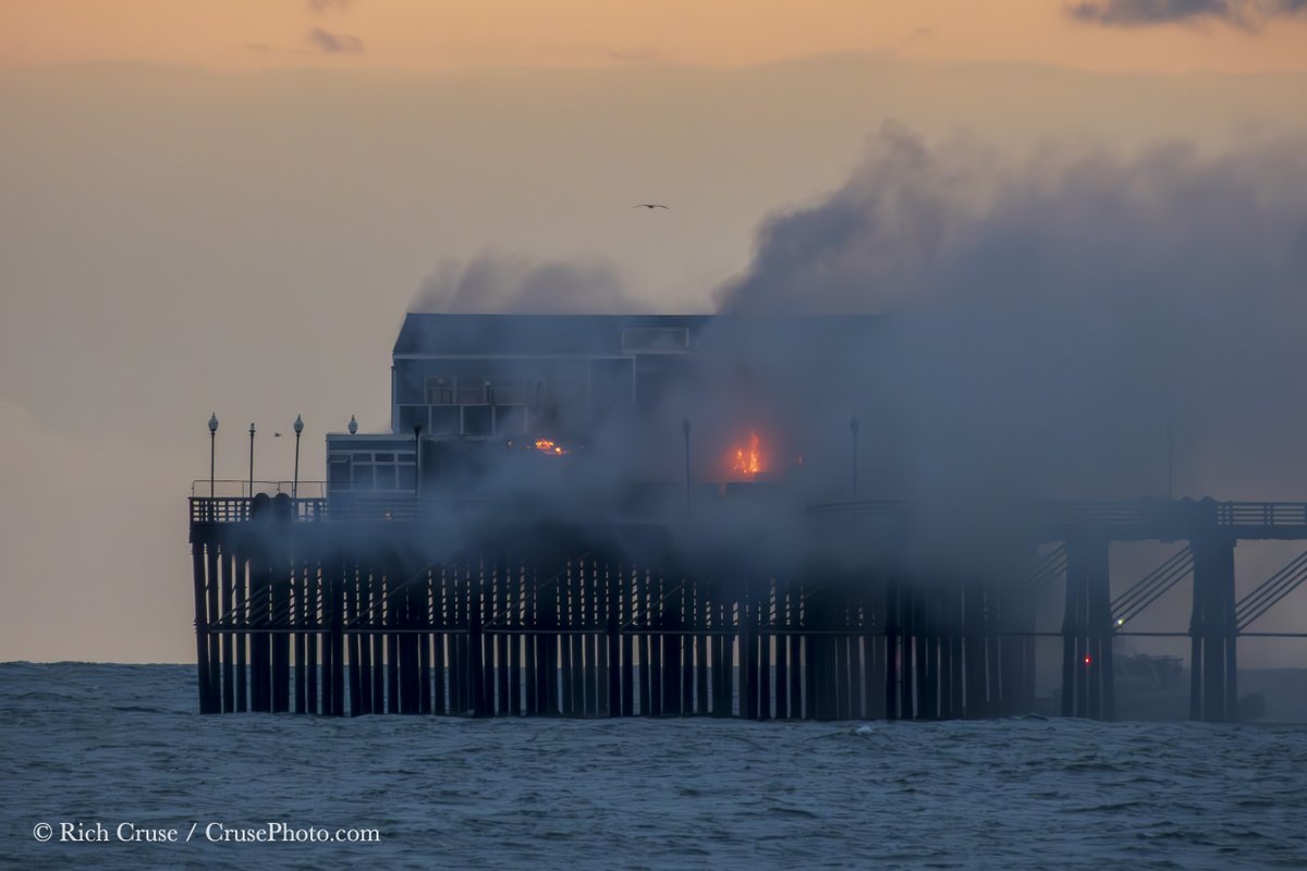 The #OceansidePier is still burning! Flames inside the old Ruby's Diner. #OceansideFire #Oceanside #StormHour #ThePhotoHour #CAwx