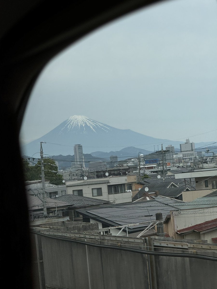 Mt. Fuji from the wrong side of the homebound train. She’s losing her winter cap.