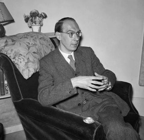 Meanwhile telephones crouch, getting ready to ring    In locked-up offices, and all the uncaring Intricate rented world begins to rouse. The sky is white as clay, with no sun. Work has to be done. Postmen like doctors go from house to house. Philip Larkin