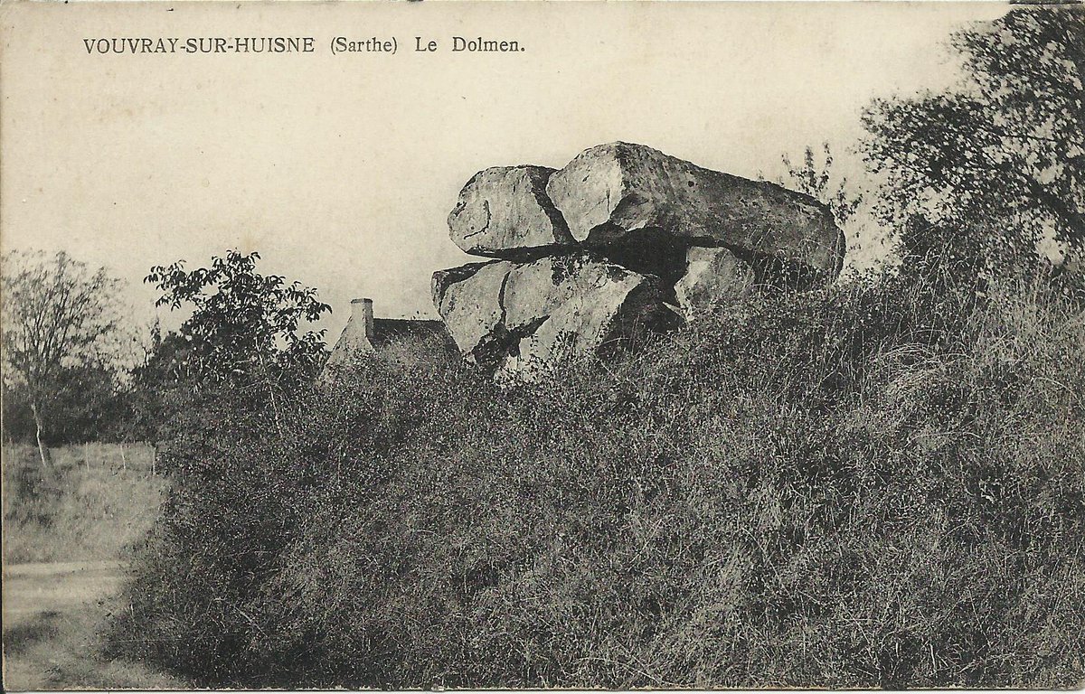 The dolmen des Roches in Vouvray-sur-Huisne (Sarthe) is perched on an embankment above the road. It now has 2 capstones and 4 orthostats one of which is a re-used polissoir. Possibly a dolmen angevin but too damaged to be certain.