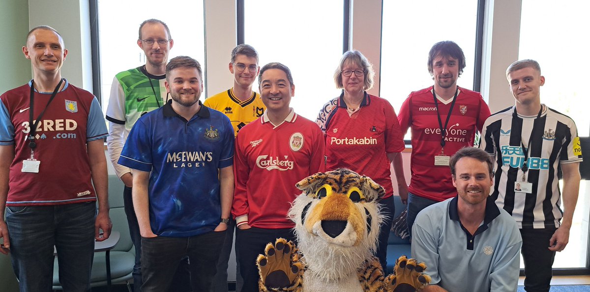 Yorkie_Chris's tweet photo. Fundraiser held in office on Tuesday @BobbyMooreFund - we all wfh on Fridays 🤣.  £350 raised, plus matched funding from work, so £700 heading your way.

In memory of my Mum, who we sadly lost to bowel cancer in 2022.

#FootballShirtFriday

Pic with some of my workmates and a 🐯 https://t.co/RAbmvlTBMY