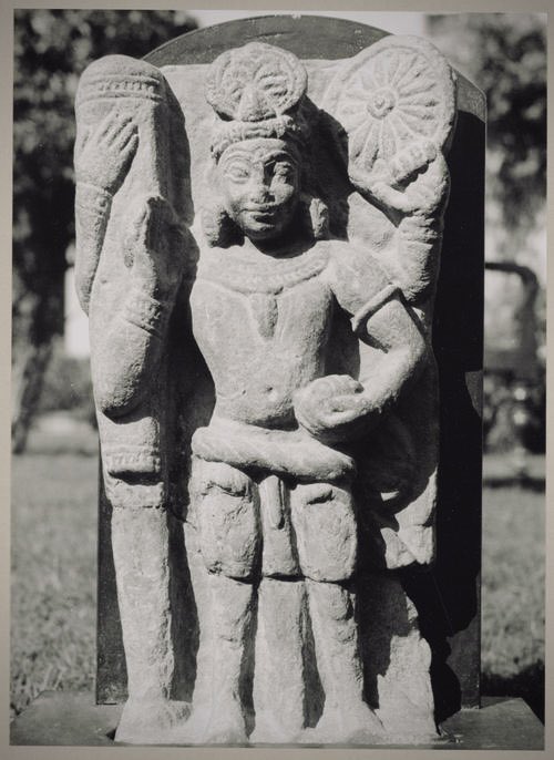 Vishnu, depicted with four arms, holds a Chakra, Conch, and Mace, while one hand is in the Abhay Mudra.

1st-3rd Century, Mathura Style

(The size of the mace is comparable to that of the sculpture of Malhar Vishnu from 200 BCE.)